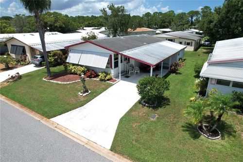 1070 Manila Dr, Barefoot Bay, FL, 32976-6702 | Card Image