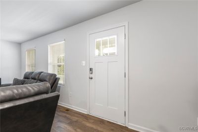 Foyer entrance with dark wood-type flooring and plenty of natural light | Image 2