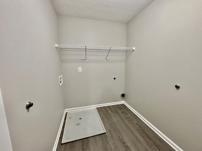 The utility room is nice size with LVP fooring | Image 12