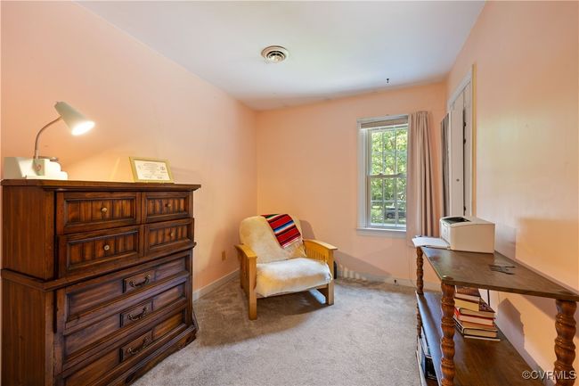 Center front bedroom, perfect for an office. Closet with access to attic. | Image 20