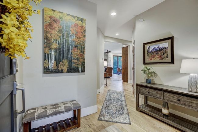 Corridor with wood finished floors, recessed lighting, and baseboards | Image 32