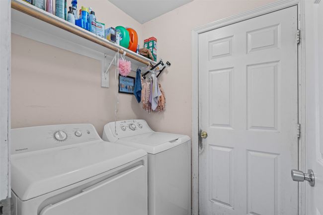 Laundry room with washer and clothes dryer | Image 13