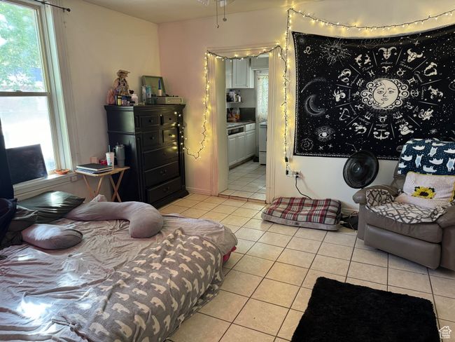 Bedroom with ensuite bath and light tile patterned floors | Image 7