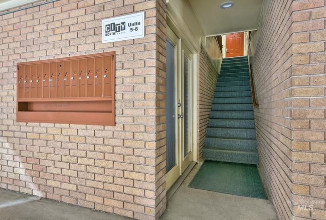 View of exterior entry featuring brick siding | Image 4
