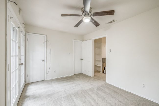 Unfurnished bedroom featuring carpet flooring and a ceiling fan | Image 16