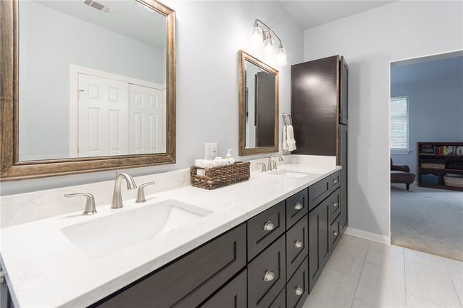 Full bath featuring double vanity and tile patterned flooring | Image 17