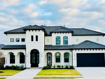 Stunning Toll brother signature Mediterranean elevation with tile roof. | Image 1