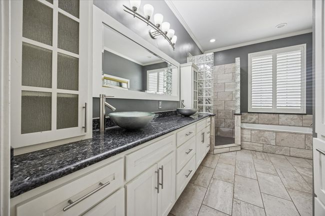Two vanities with lots of storage space. | Image 28