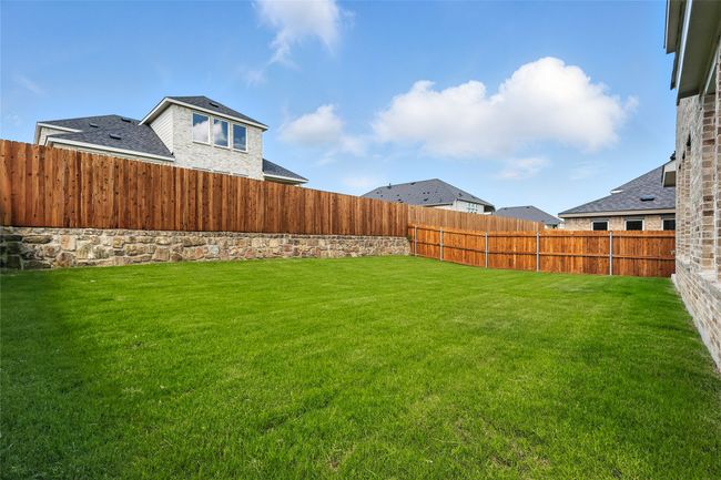 View of fenced backyard | Image 35