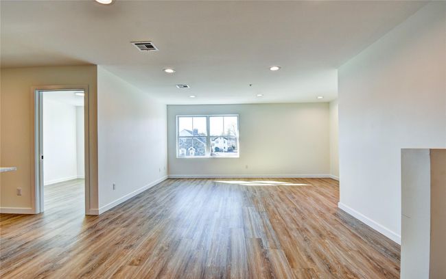 Empty room featuring recessed lighting, wood finished floors, and visible vents | Image 29