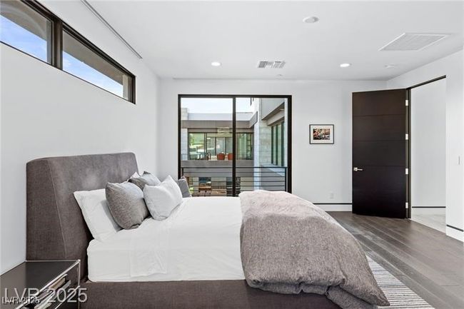 Bedroom with recessed lighting, visible vents, access to outside, and wood finished floors | Image 39