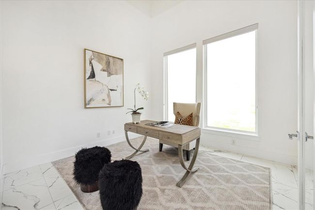 STUDY/HOME OFFICE: The epitome of a modern workspace - The home office/study is designed with both functionality and style in mind. The room is bathed in natural light, thanks to its large windows, creating an inspiring and energizing environment for productivity. The clean lines and minimalist aesthetic adds to the room's sophisticated charm. | Image 5