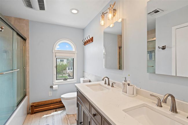 Home office featuring a baseboard radiator, light wood finished floors, recessed lighting, and a ceiling fan | Image 27