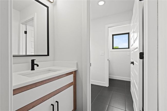 Bathroom with vanity and tile patterned flooring | Image 30