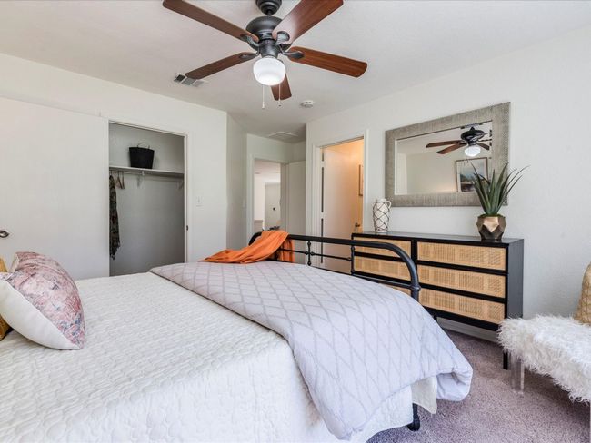 The primary suite sits at the back of the home overlooking the backyard and comes with a large walk-in closet and a private ensuite bathroom. | Image 16