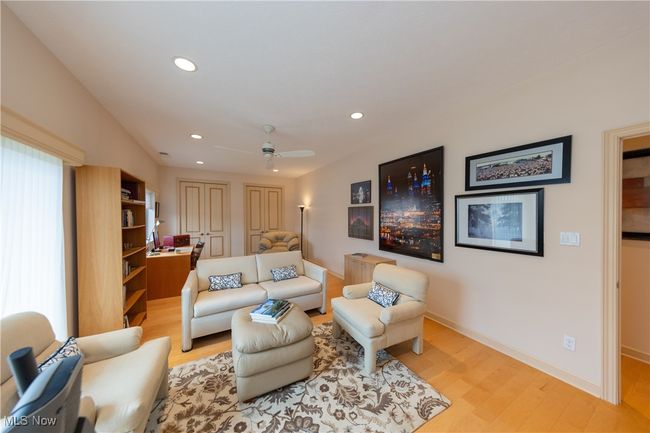 Guest Bedroom 1 sitting area with baseboards, recessed lighting, a ceiling fan, and light wood finished floors | Image 39