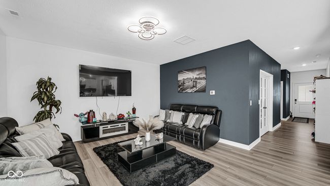 living area with light wood finished floors, recessed lighting, and baseboards | Image 13