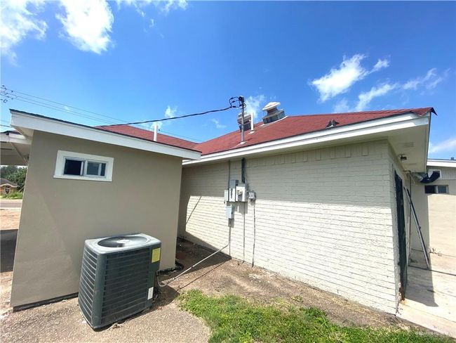 View of property exterior featuring central AC unit | Image 6
