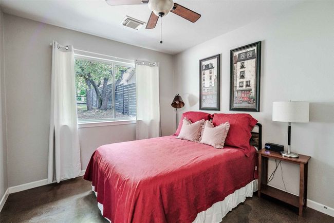 Bedroom with baseboards, visible vents, ceiling fan, and carpet | Image 11
