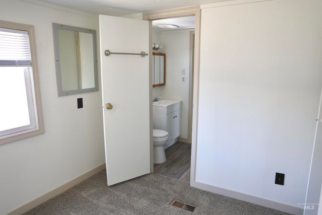 Half bathroom with plenty of natural light and vanity | Image 14