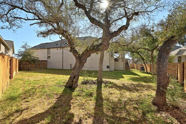 The spacious backyard offers a private retreat, with plenty of room for outdoor activities and potential for future landscaping or a garden. | Image 26
