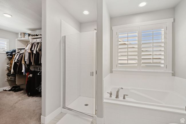 Full bath with a bath, a stall shower, a walk in closet, and recessed lighting | Image 21