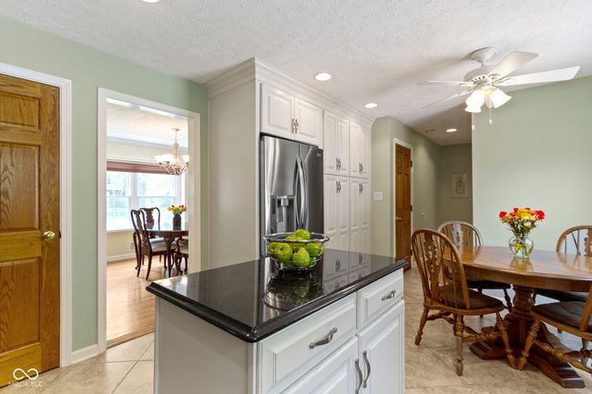 Movable Island with Pull Out Shelves and Two Floor to Ceiling Pantry Cabinets! | Image 15