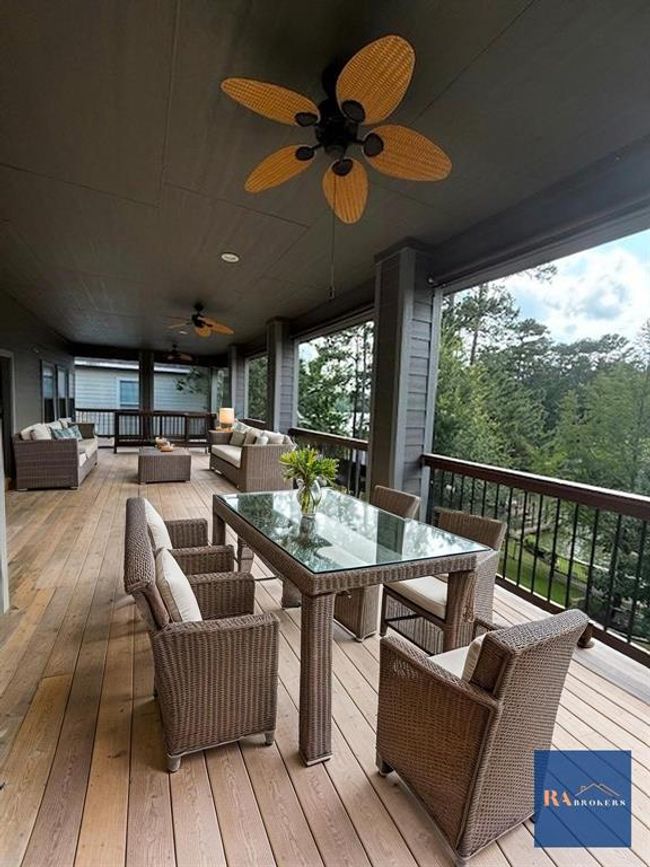 The expansive upper porch includes ceiling fans, and an unbelievable view of your surroundings. Ideal for relaxation and entertaining. (virtually staged) | Image 32