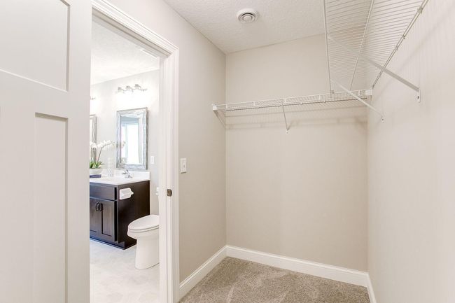 Primary walk-in closet (pic from a previous model).jpg | Image 14