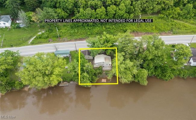 Aerial overview of property's location featuring a nearby body of water and property boundaries highlighted | Image 30