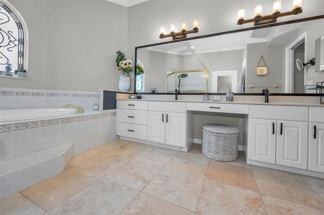 Primary Suite Bath - travertine floors | Image 24