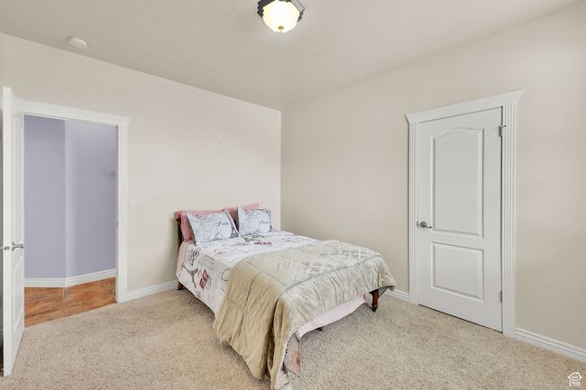 Bedroom featuring carpet floors and baseboards | Image 36