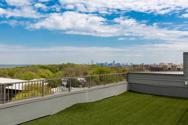 View of yard with a balcony and a skyline view | Image 10