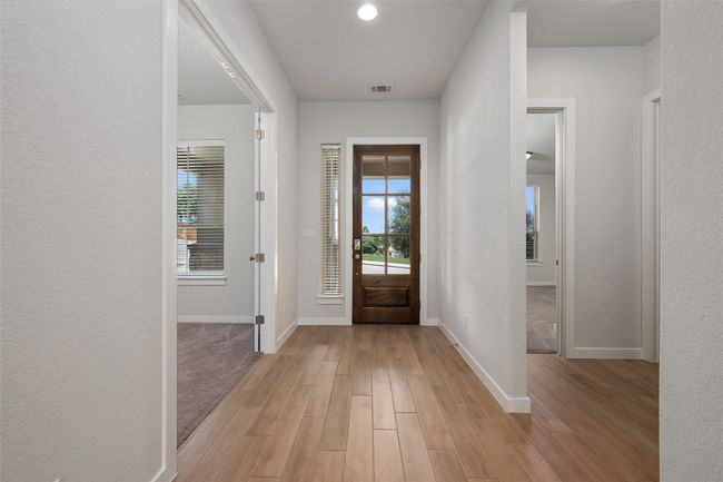 Entryway with plenty of natural light and light wood-like tile floors | Image 7