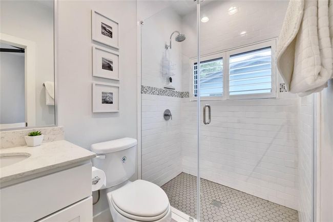 Bathroom featuring vanity and a stall shower | Image 16