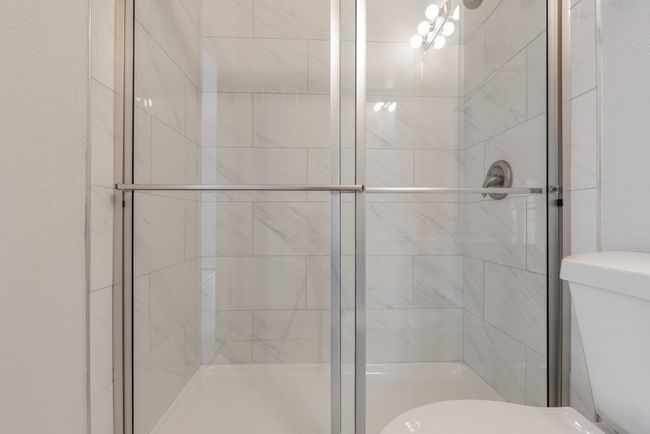 Bathroom with a stall shower | Image 7