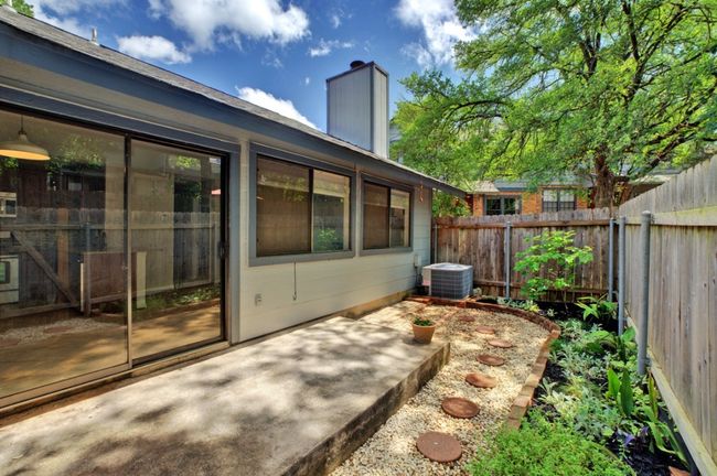 Spacious and private, this fully fenced patio offers a great space for entertaining or enjoying breezy days. | Image 25