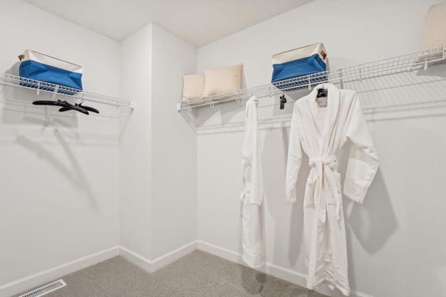 Photo is of the actual model. The primary bedroom features an incredible walk-in closet. | Image 17