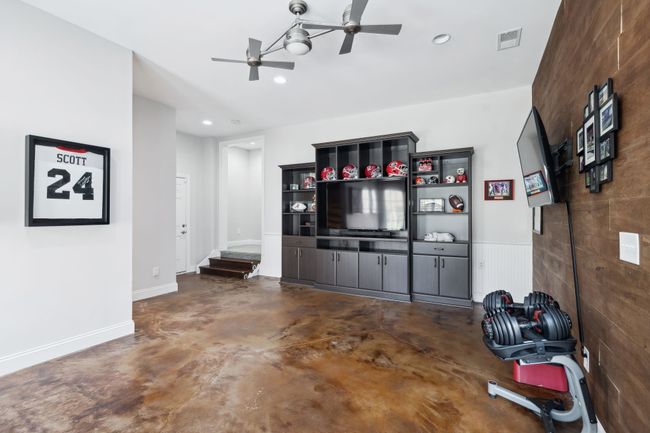 Entertainment and game space with built-ins and mounted TV. | Image 36