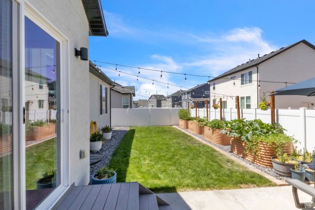 Fenced backyard with a residential view | Image 29