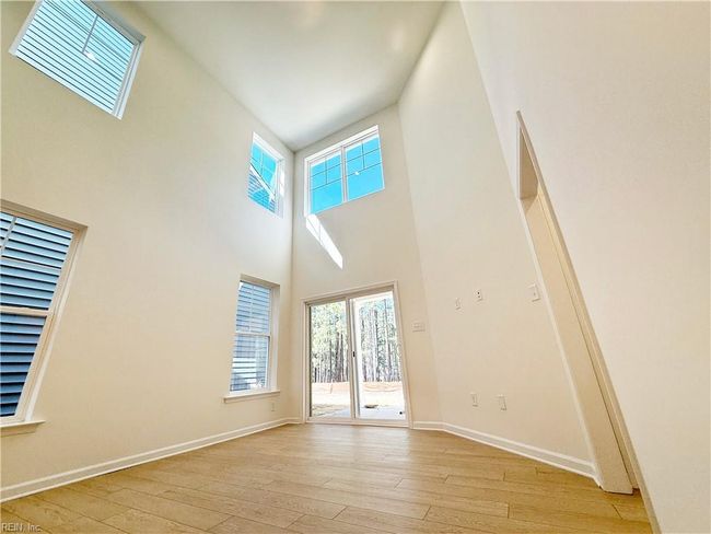 Spacious and bright two-story family room. | Image 4