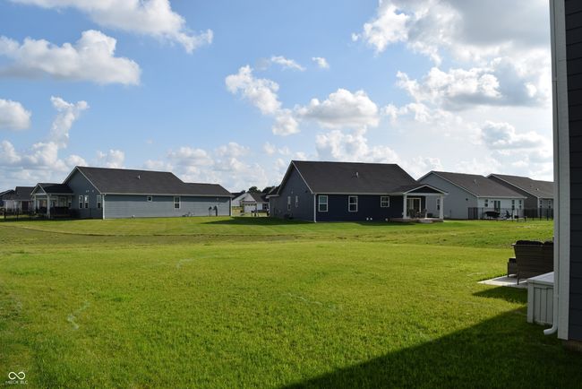 another view of the large back yard from the back left corner of the home | Image 12