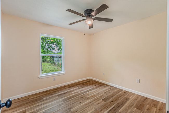 Empty room featuring a ceiling fan, baseboards, and light wood-style floors | Image 19