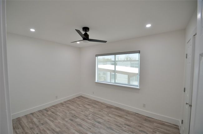 Unfurnished bedroom with recessed lighting, light wood-style floors, and ceiling fan | Image 9