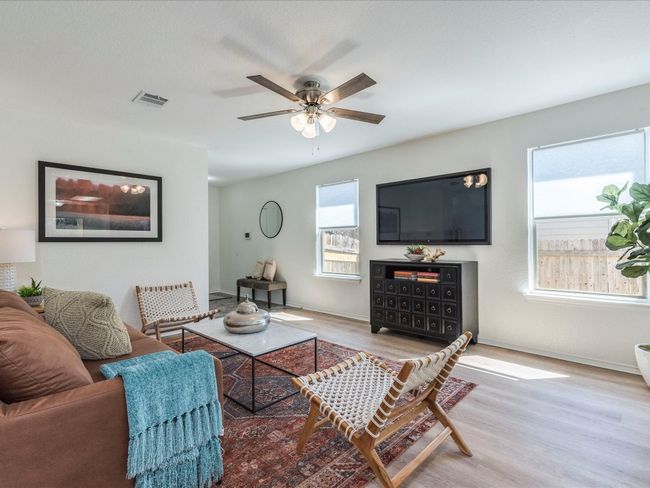 Abundant natural light flows throughout the main living area setting a welcoming and relaxing atmosphere. | Image 12