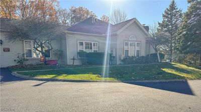 View of side of property with a lawn | Image 2