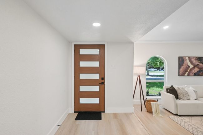 Entryway with wood finished floors, recessed lighting, and ornamental molding | Image 7