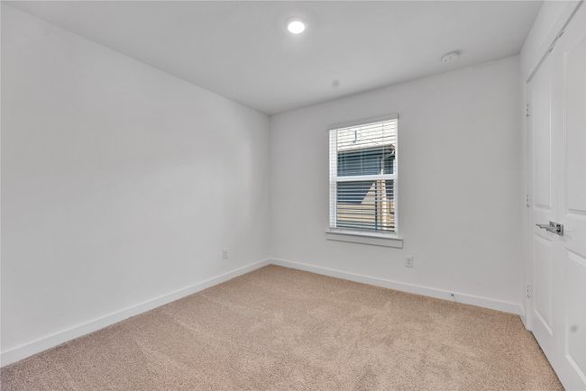Spare room featuring light carpet and baseboards | Image 21