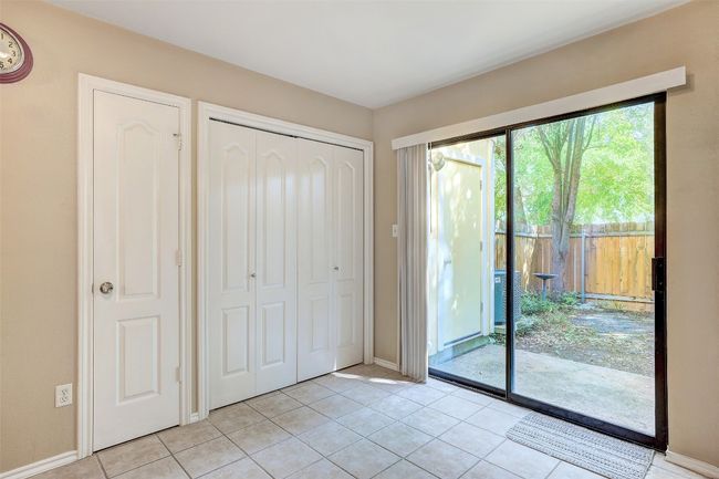 Doorway featuring baseboards and light tile patterned flooring | Image 18