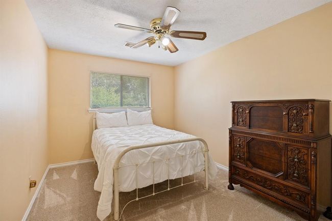 Bedroom #4 is an inviting space with sunny windows and a roomy closet - perfect for family or visitors! | Image 35